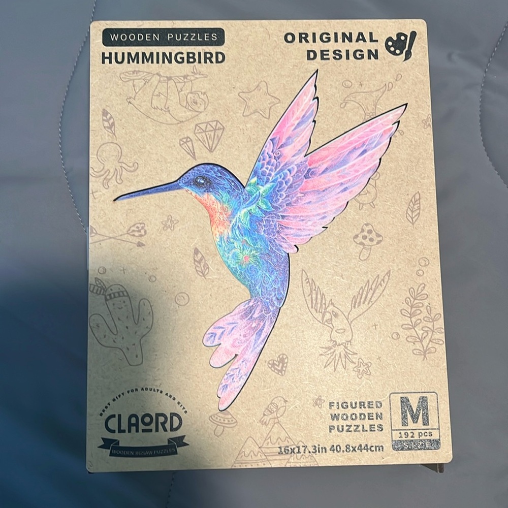 Brand new opened wooden puzzle . Hummingbird